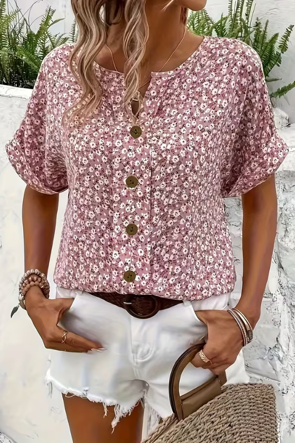 Comfortable short sleeve women's floral blouse. Relaxed fit, breezy fabric for effortless summer style.