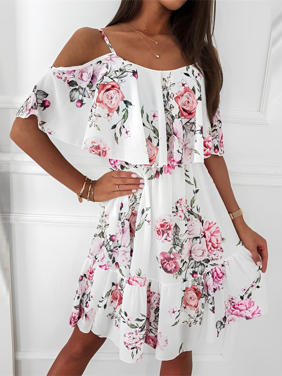 Women's effortless floral cold shoulder mini dress with flowy ruffles. Perfect for summer and spring.