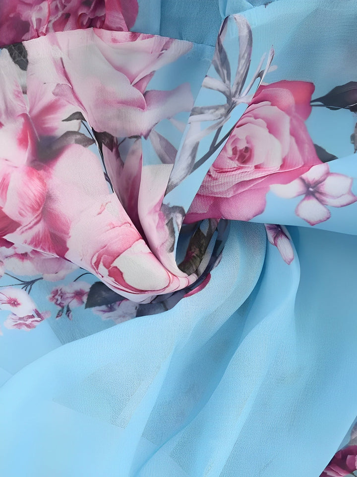 Tiered skirt and ruffle details on a women's short floral cold shoulder mini dress.