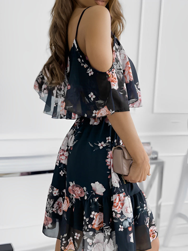 Styled women's floral cold shoulder mini dress, perfect for a chic and effortless summer look.