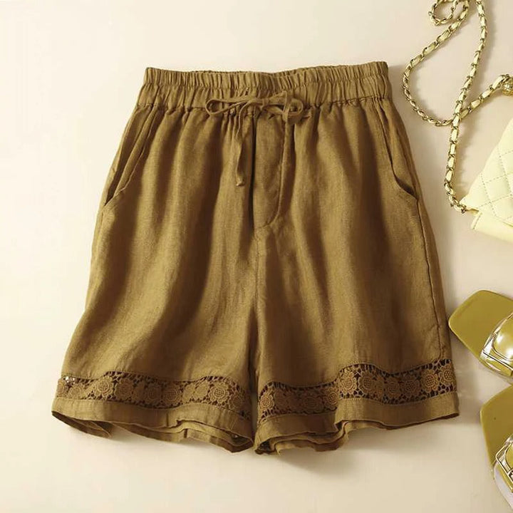 Comfortable women's embroidered floral shorts featuring an elastic waist for a relaxed fit, perfect for summer.