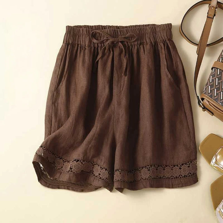 Lightweight women's floral shorts with elastic waist, offering a comfortable, relaxed fit for summer casual wear.