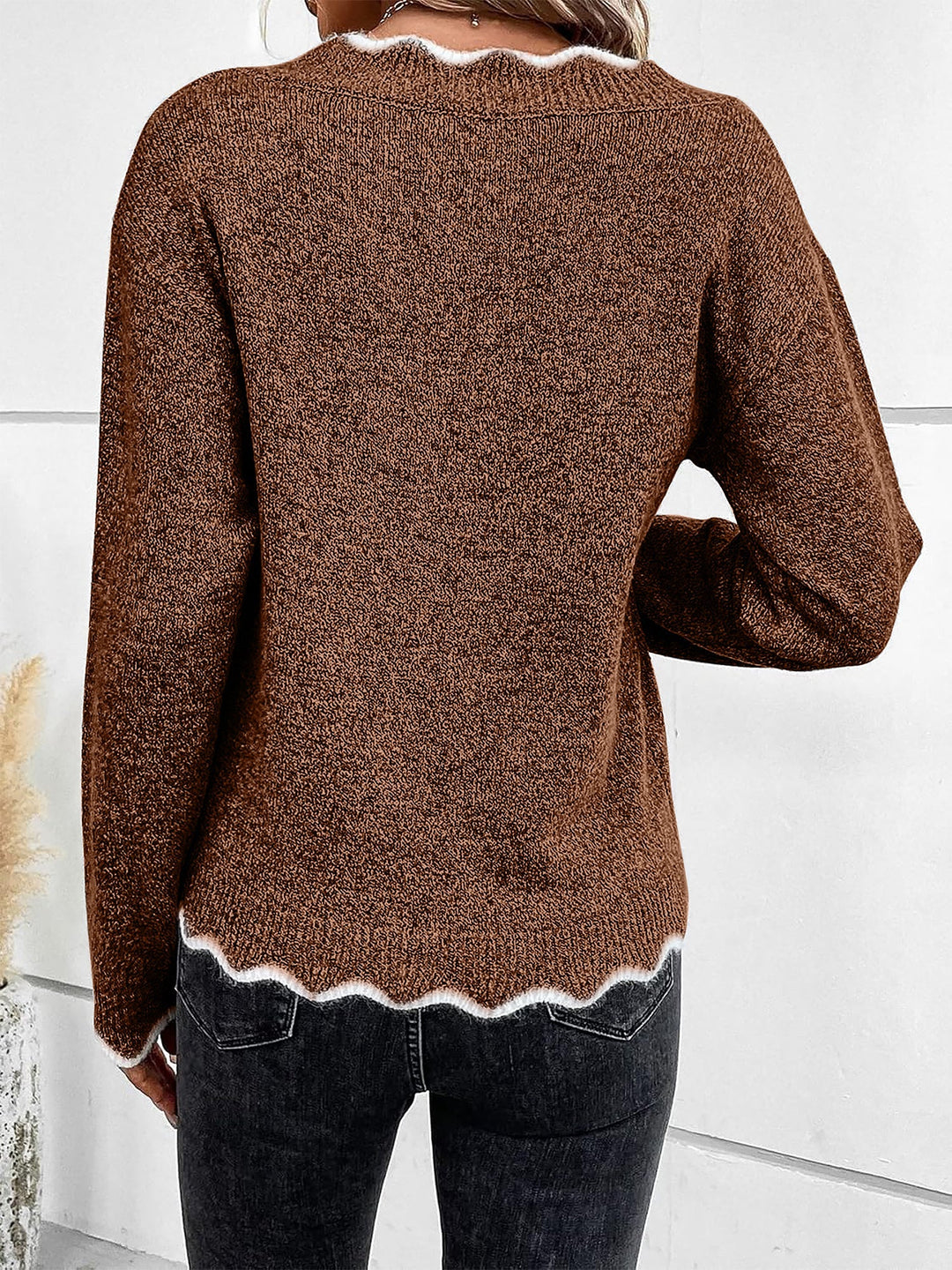 Relaxed fit women's notch V neck pullover for comfortable everyday style.