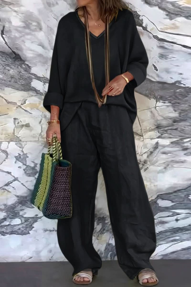 Women's effortless open back pantsuit set, a stylish two-piece with wide-leg pants & matching top for summer.