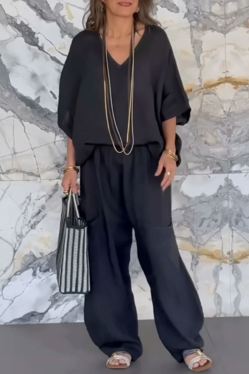 Chic women's open back top & matching pants set. A versatile two-piece for stylish and comfortable wear.