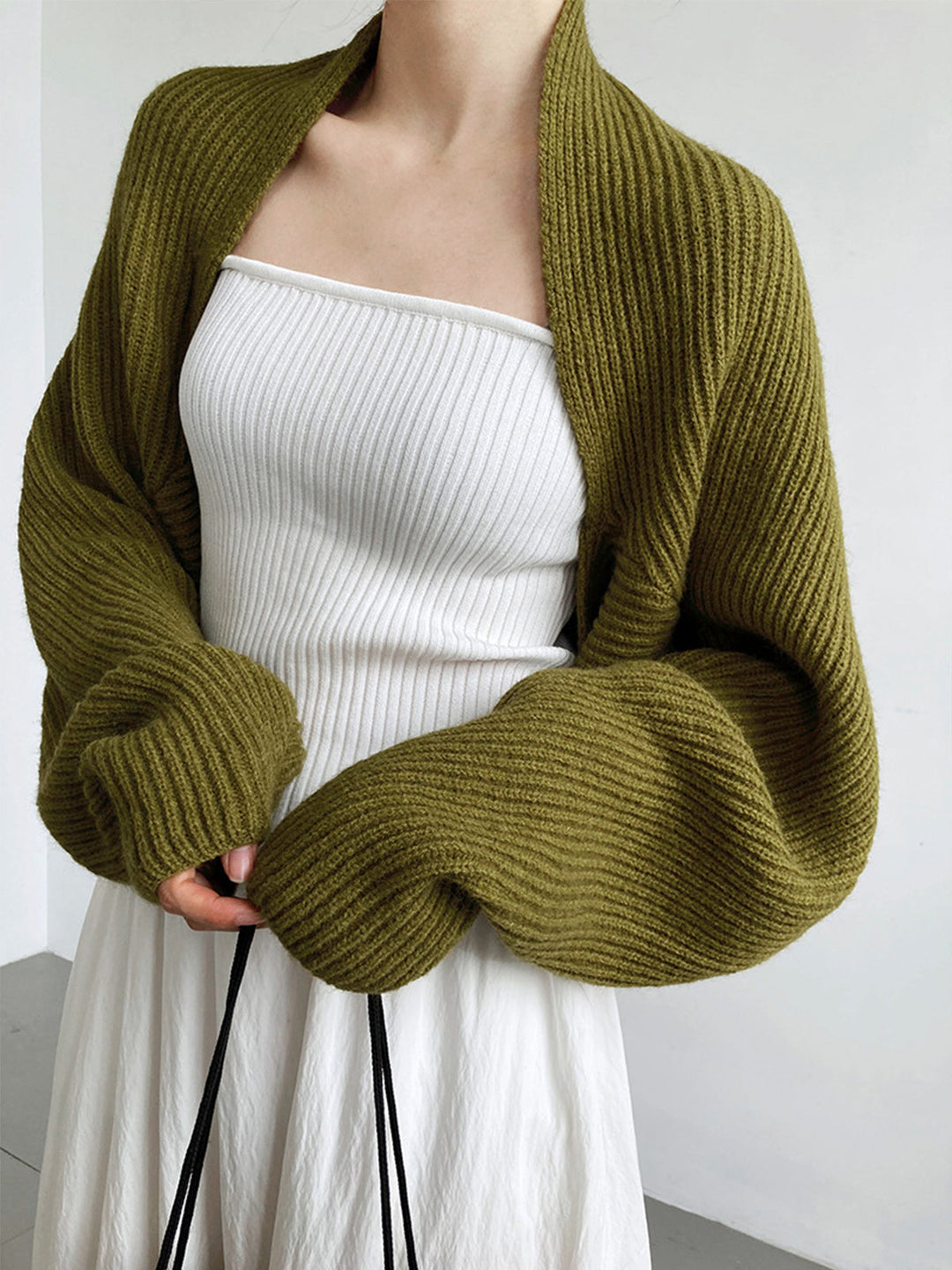 Women's effortless open-front long sleeve shrug sweater, ideal for comfortable and versatile layering.