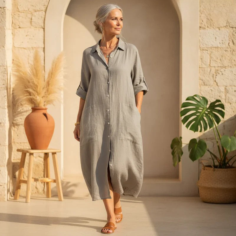 Women's effortless oversized button down shirt dress in a flowing midi length for casual comfort.