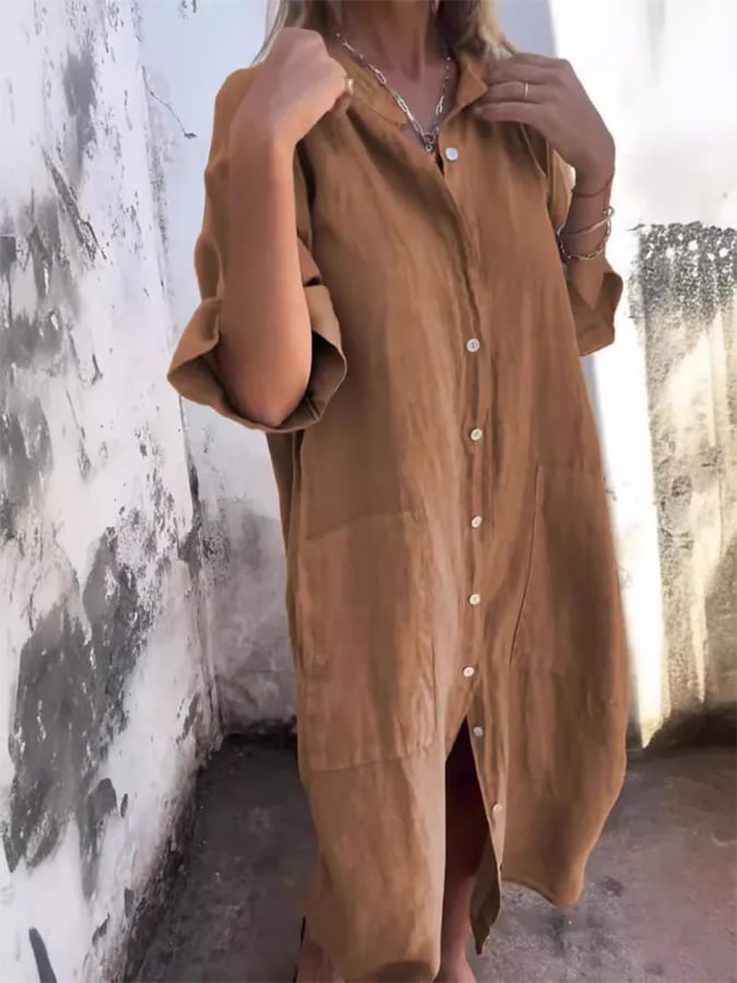 Flowing women's oversized shirt dress, a comfortable button down design suitable for any casual occasion.