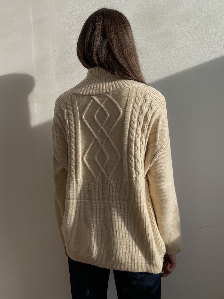 Relaxed fit women's oversized knit sweater. A chic, versatile top offering cozy comfort for everyday casual wear.