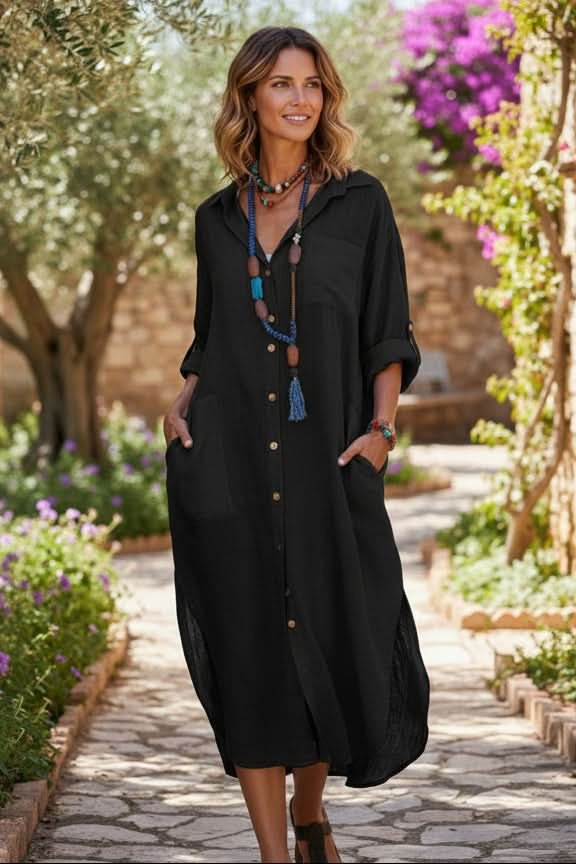 Flowy women's boho midi shirt dress. V-neck, oversized, and relaxed fit. Ideal casual summer vacation wear.
