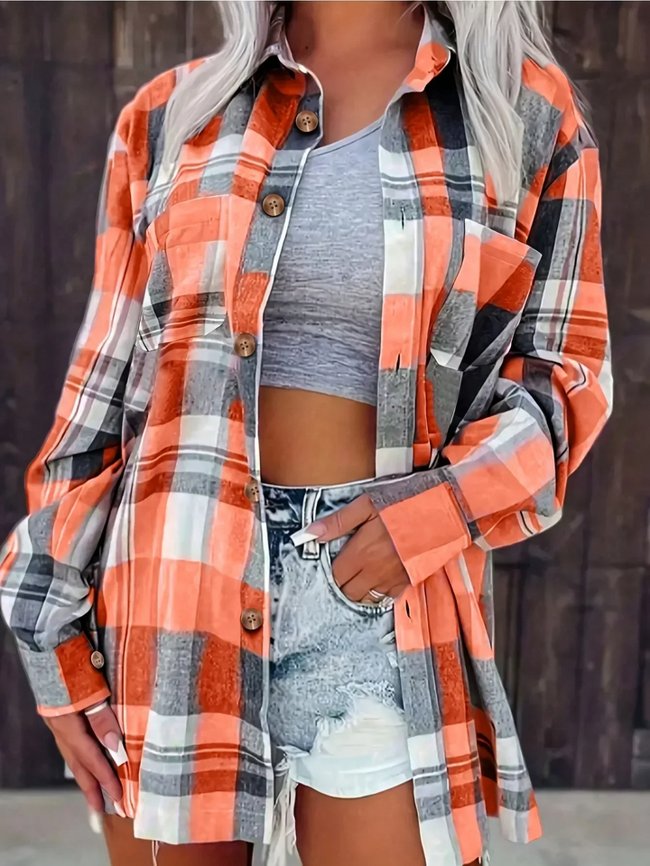 Casual women's plaid button-down shirt, featuring a classic pattern and comfortable long sleeves.