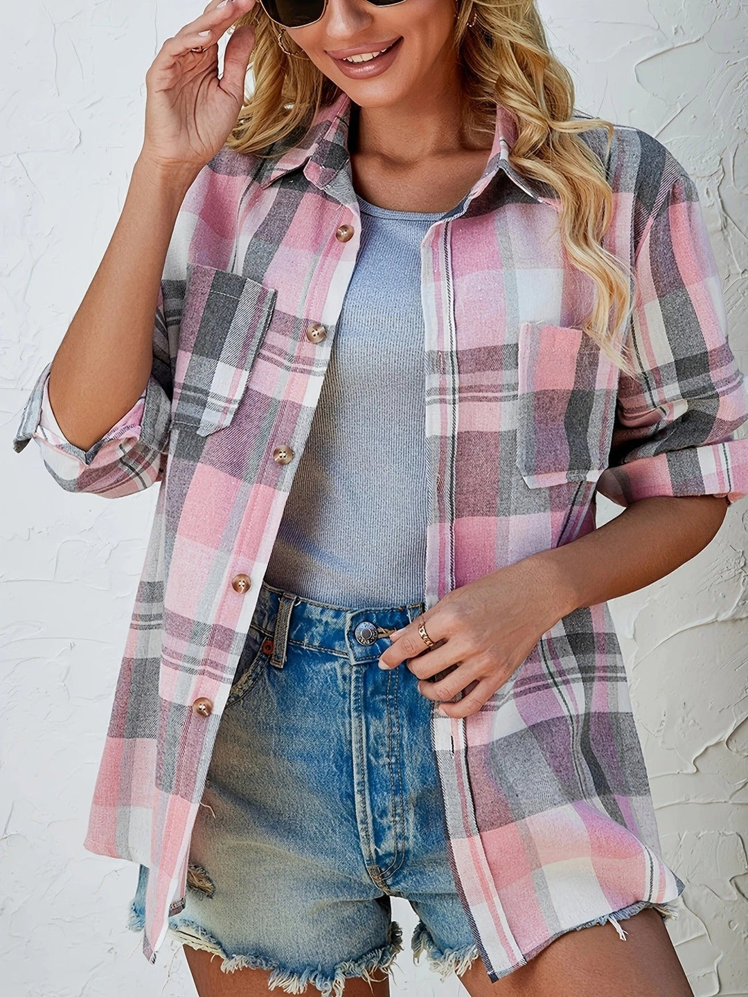 Comfortable women's button-down plaid shirt, effortless style for everyday wear.