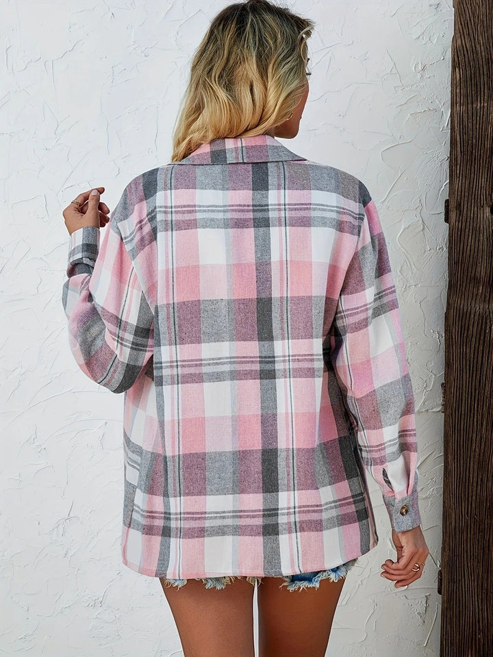 Close-up of a women's plaid button-down shirt fabric, showcasing the soft texture.