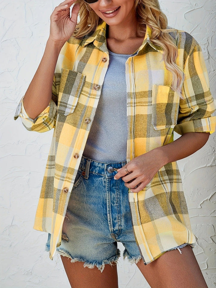 Women's long sleeve plaid button-down shirt, styled open over a t-shirt for a layered look.