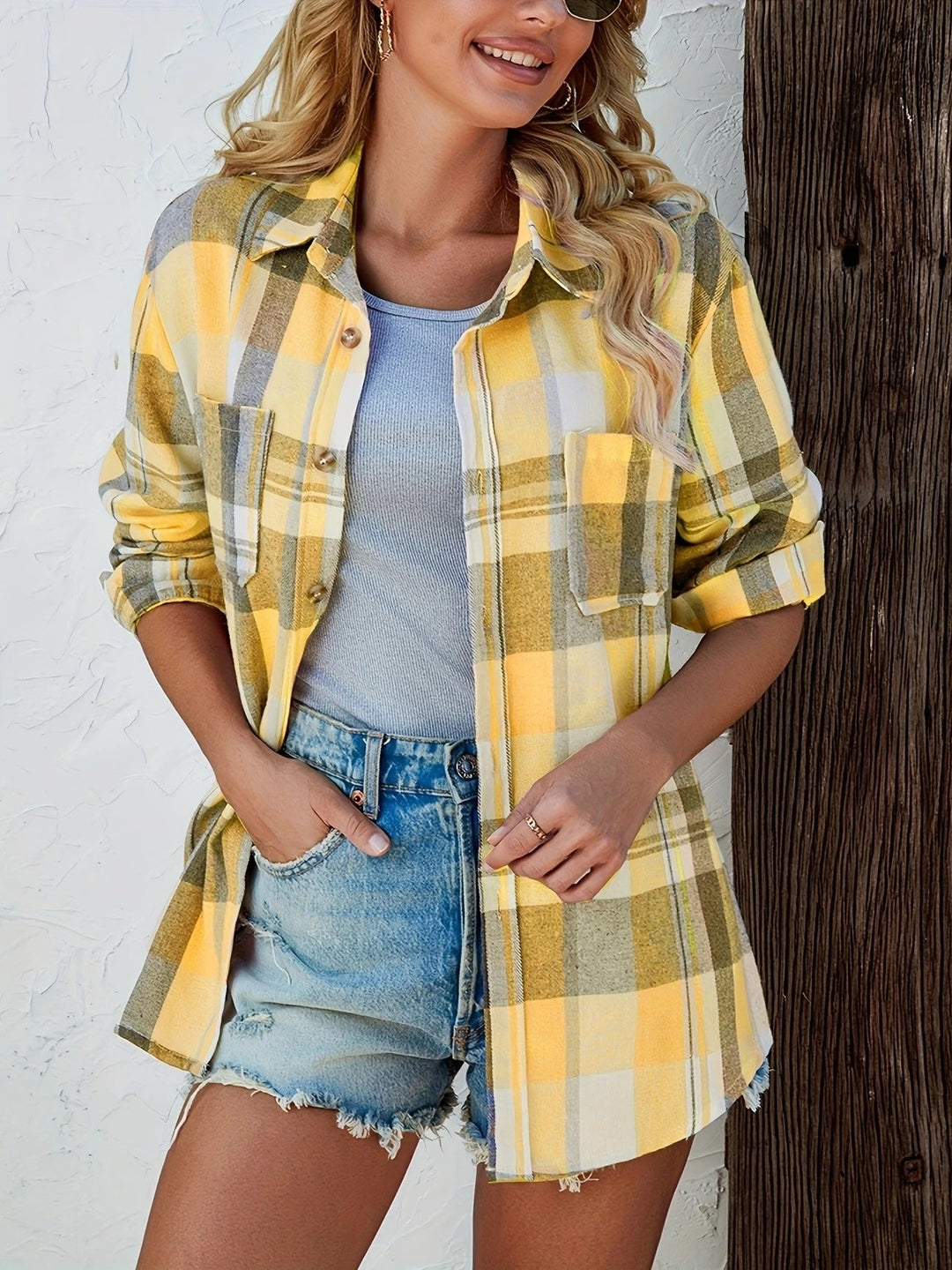 Stylish women's button-down plaid top, designed for effortless casual comfort.