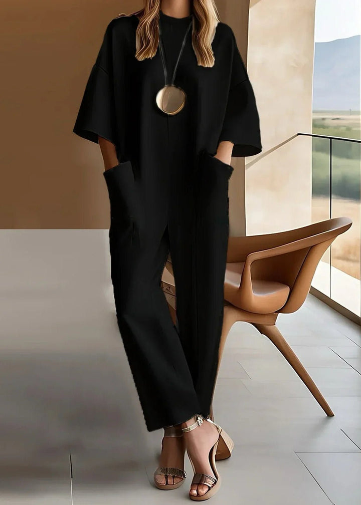 Chic women's short sleeve wide leg jumpsuit. Relaxed one-piece for versatile spring & everyday casual style.