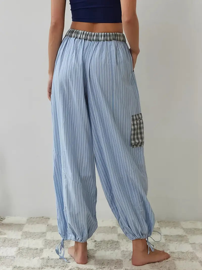 Effortless women's striped lounge set, a comfortable and chic two-piece for relaxed living.