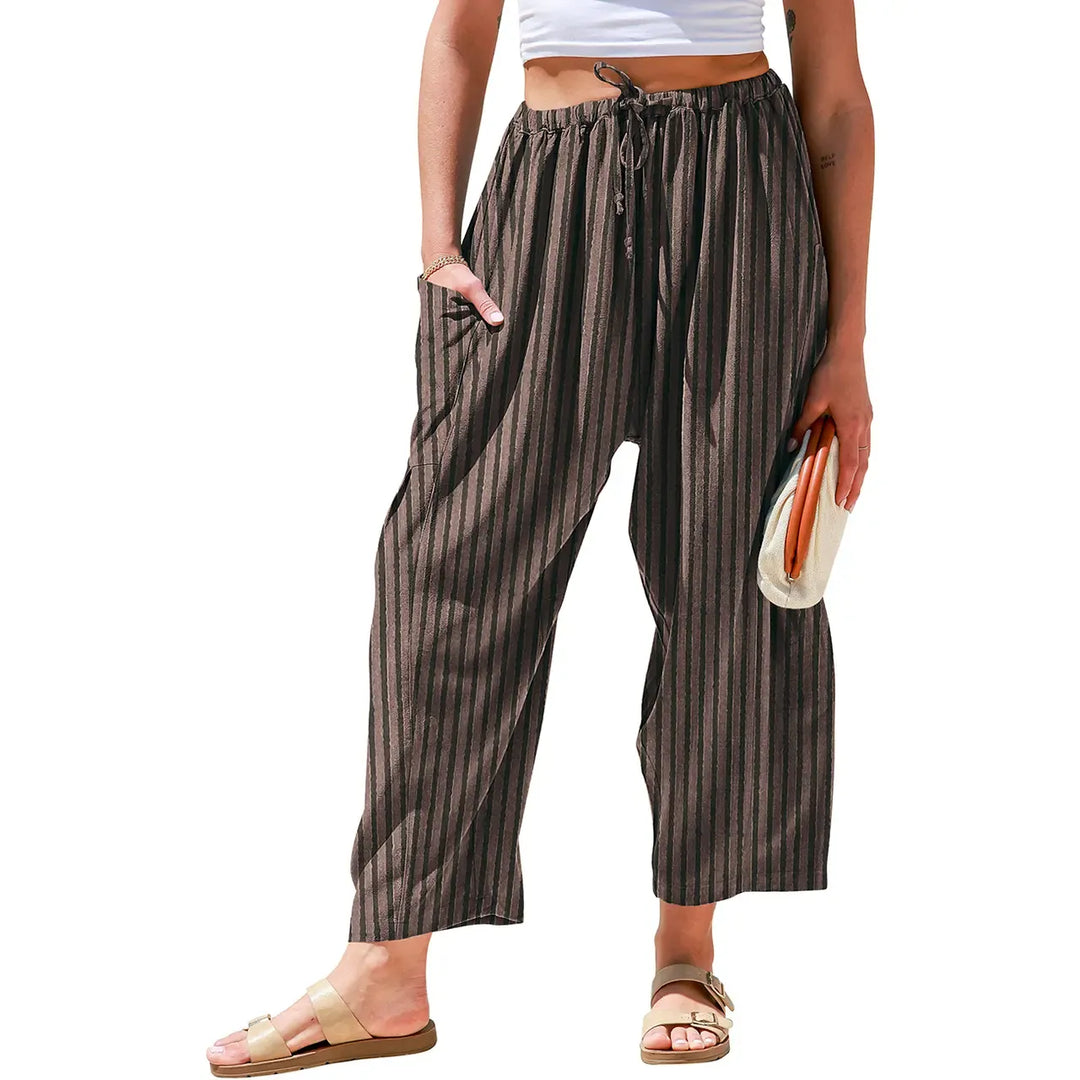 Relaxed fit women's wide-leg striped trousers with drawstring waist, perfect for summer fashion & resort.