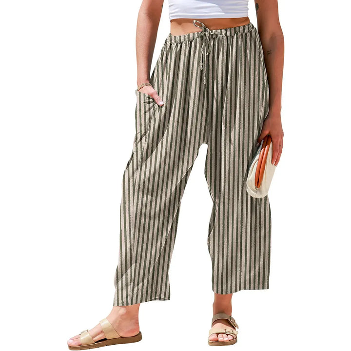 Women's wide-leg striped pants featuring a comfortable drawstring waist, perfect for relaxed, chic style.