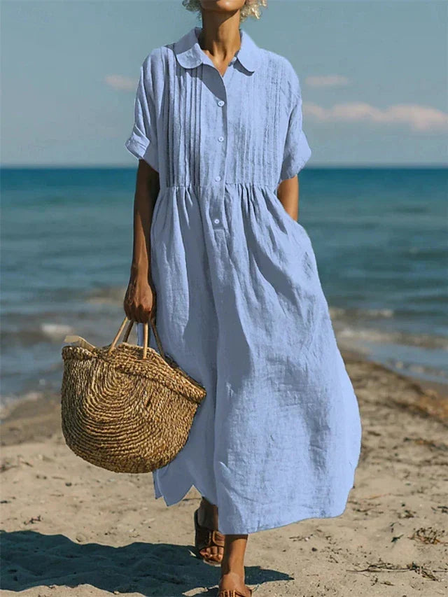 Flowy women's midi shirt dress with button-down front, comfortable and versatile for summer casual looks.