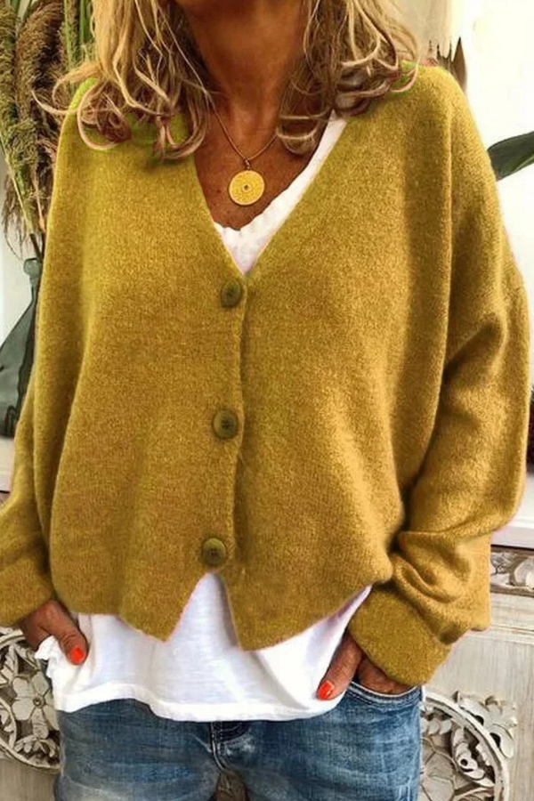 Women's relaxed fit button-front cardigan. Casual everyday fashion, office chic potential.