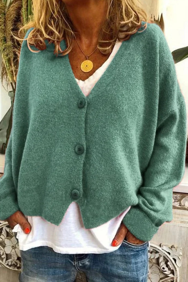 Stylish women's layering cardigan, button-front design. Great for casual wear or office.