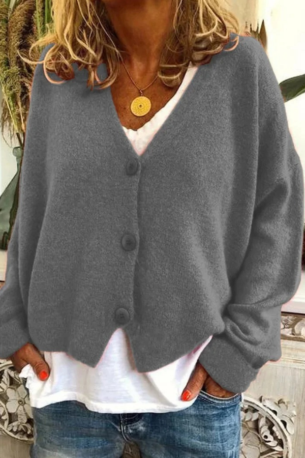 Effortless women's cardigan with buttons. Versatile layering piece for any season.