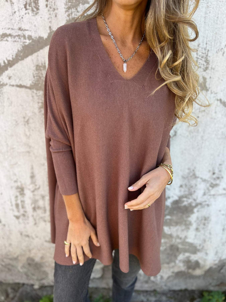 Casual women's V-neck tunic pullover. Long sleeve swing top with a relaxed fit, perfect for versatile layering.
