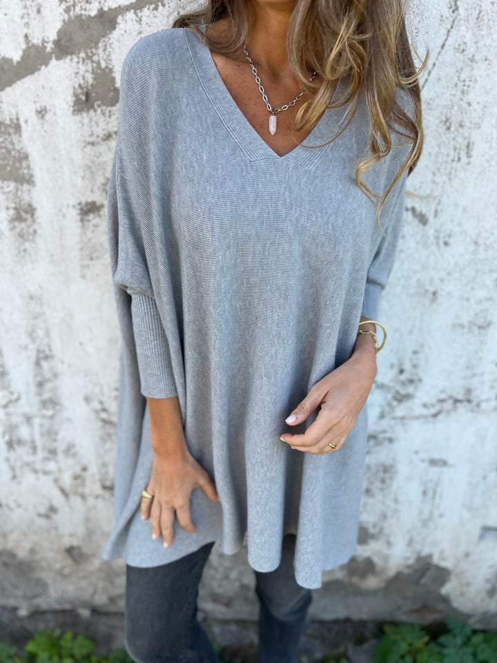 Stylish women's V-neck tunic pullover. Effortless swing design, relaxed fit jumper for fall & winter comfort.