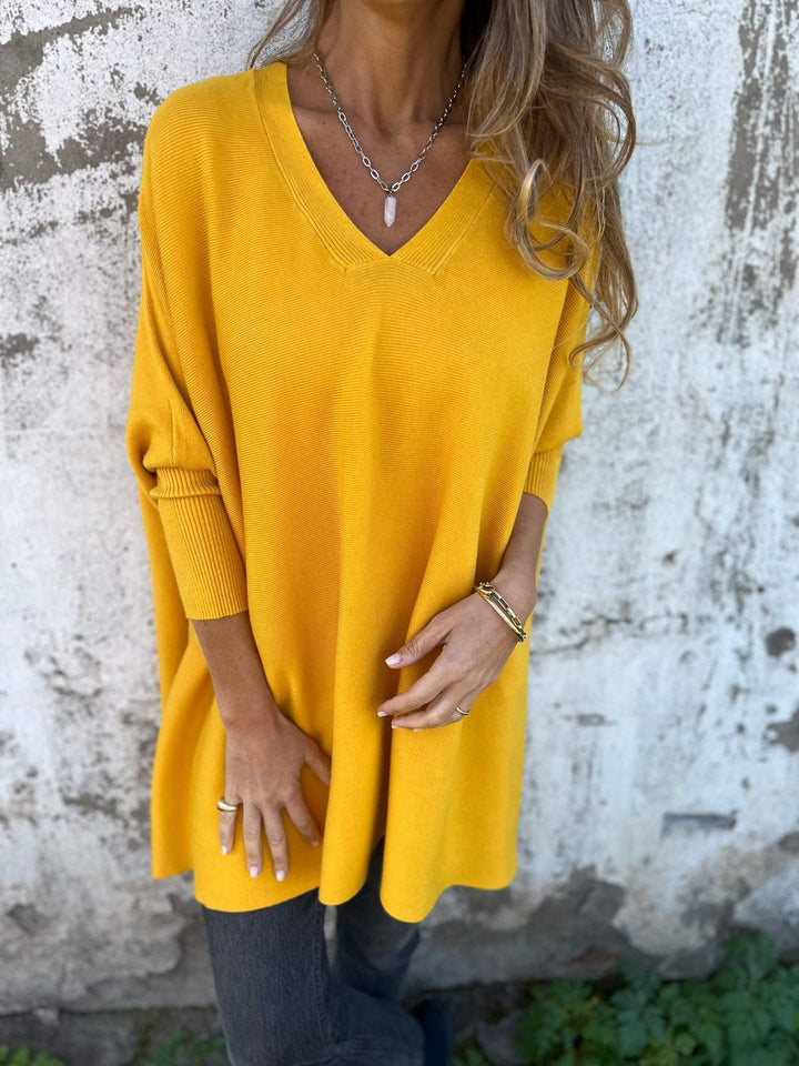 Versatile women's V-neck tunic pullover. Effortless swing long sleeve top, ideal for cool weather layering.