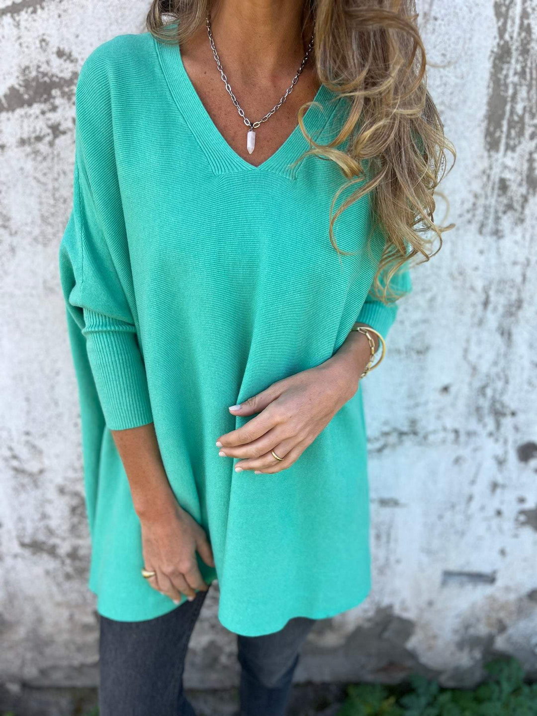 Women's winter wear V-neck tunic pullover. Effortless swing long sleeve top, relaxed fit for ultimate comfort.