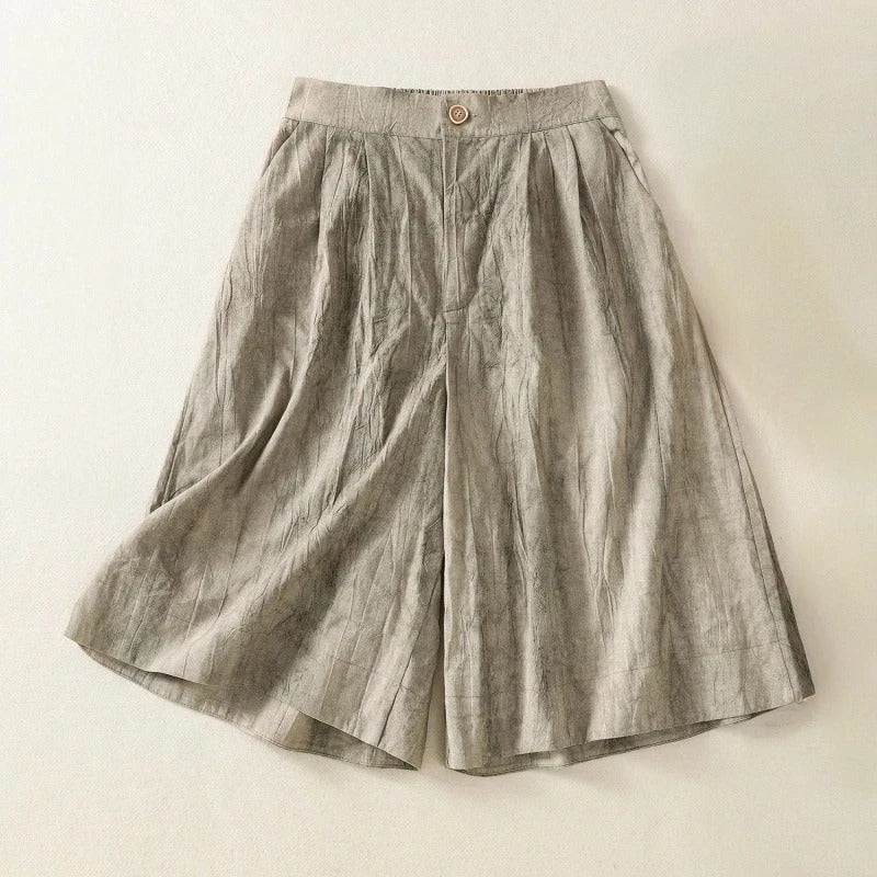 Stylish women's tie-dye high-waist shorts with relaxed fit for ultimate comfort. Features brown and gray hues.