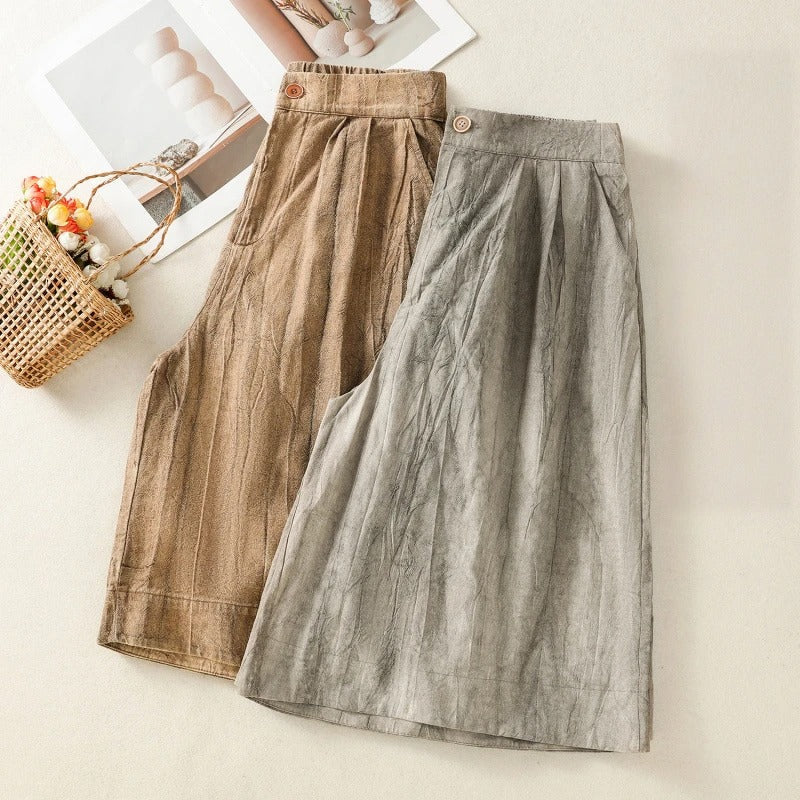 Effortless tie-dye high-waist shorts for women. Comfortable, relaxed fit in stylish brown and gray tones.