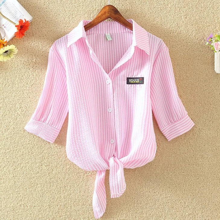 Modern women's apparel: cropped tie-front blouse with short sleeves, perfect for a chic summer fashion statement.