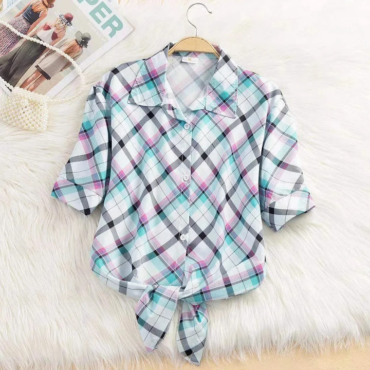 Effortless fashion top: women's cropped blouse featuring a trendy tie-front design for versatile spring style.