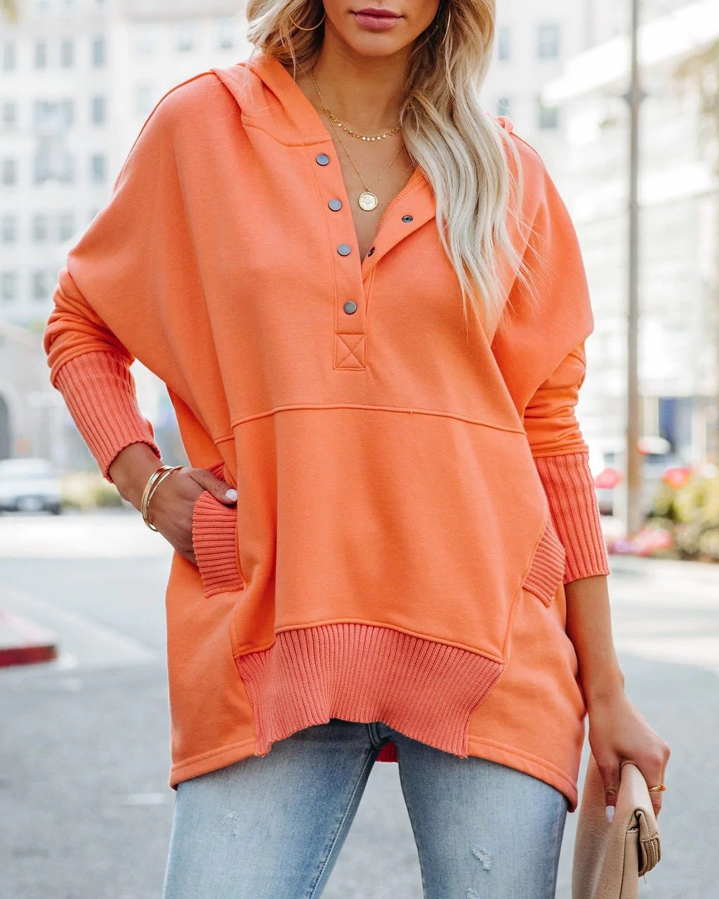 Women's effortless tunic hoodie paired with jeans, a relaxed fit long sleeve pullover for casual days.