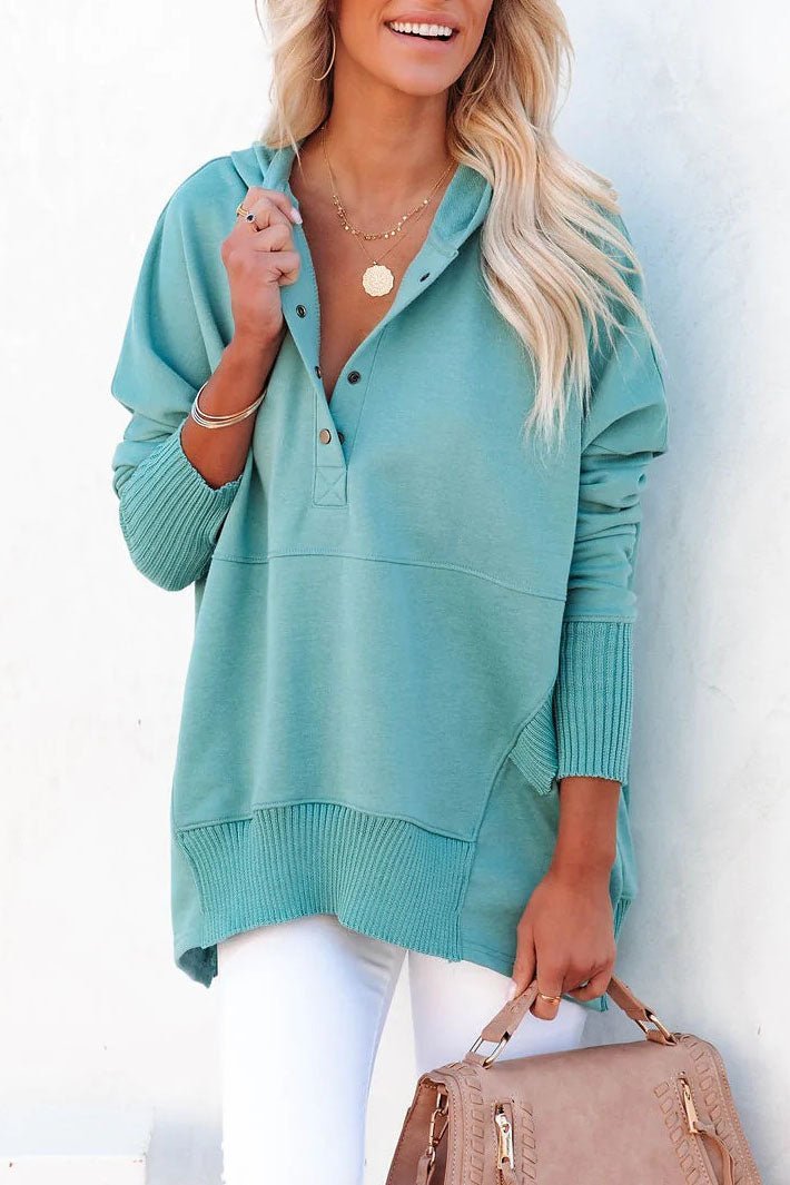 Flat lay of a women's casual longline tunic sweatshirt, a versatile relaxed fit pullover with hood.