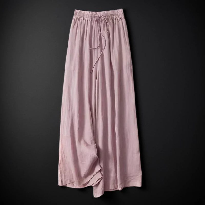 Breezy white wide-leg summer pants for women, offering an effortless and comfortable vacation style.