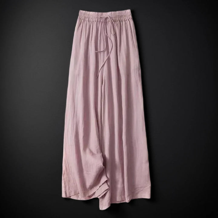 Breezy white wide-leg summer pants for women, offering an effortless and comfortable vacation style.