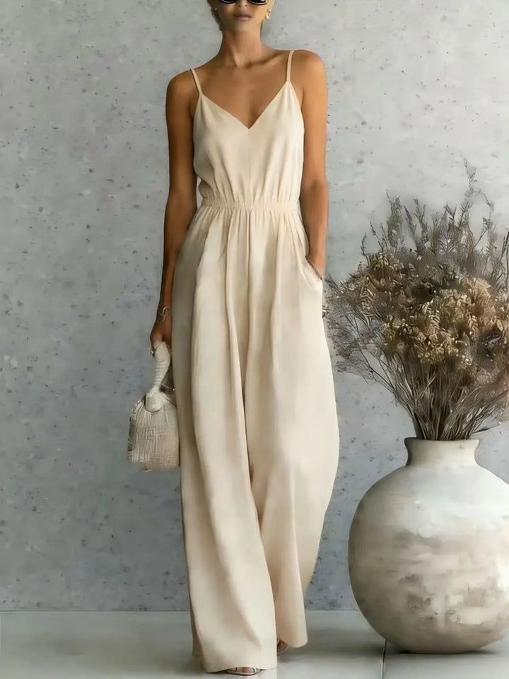 Comfortable women's one-piece wide leg jumpsuit featuring a V-neck, great for summer fashion & relaxed days.