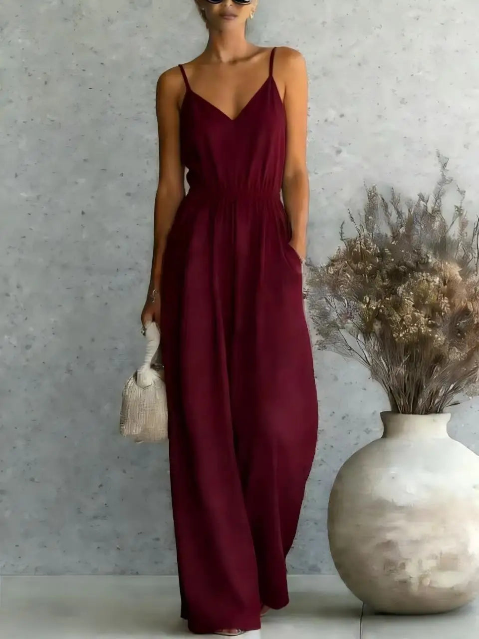 Relaxed fit V-neck wide leg jumpsuit for women, a versatile choice for casual wear, travel, or summer events.