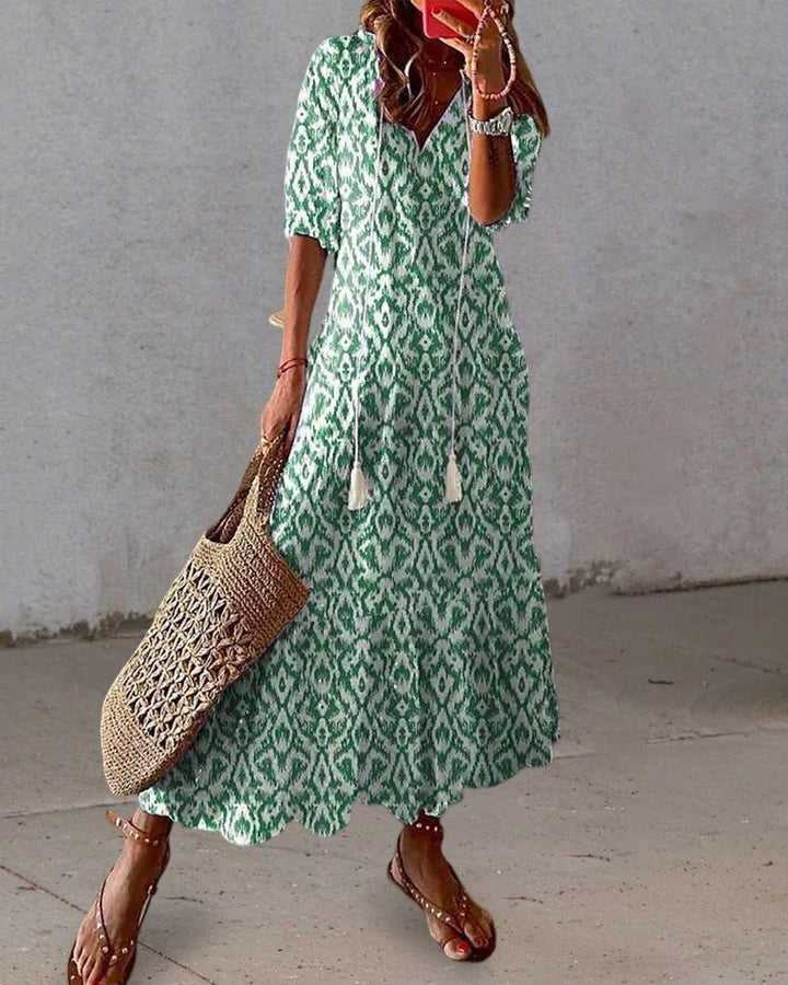 Detailed view of the vibrant print on the Elara flowy maxi dress, showcasing its stylish and comfortable design.