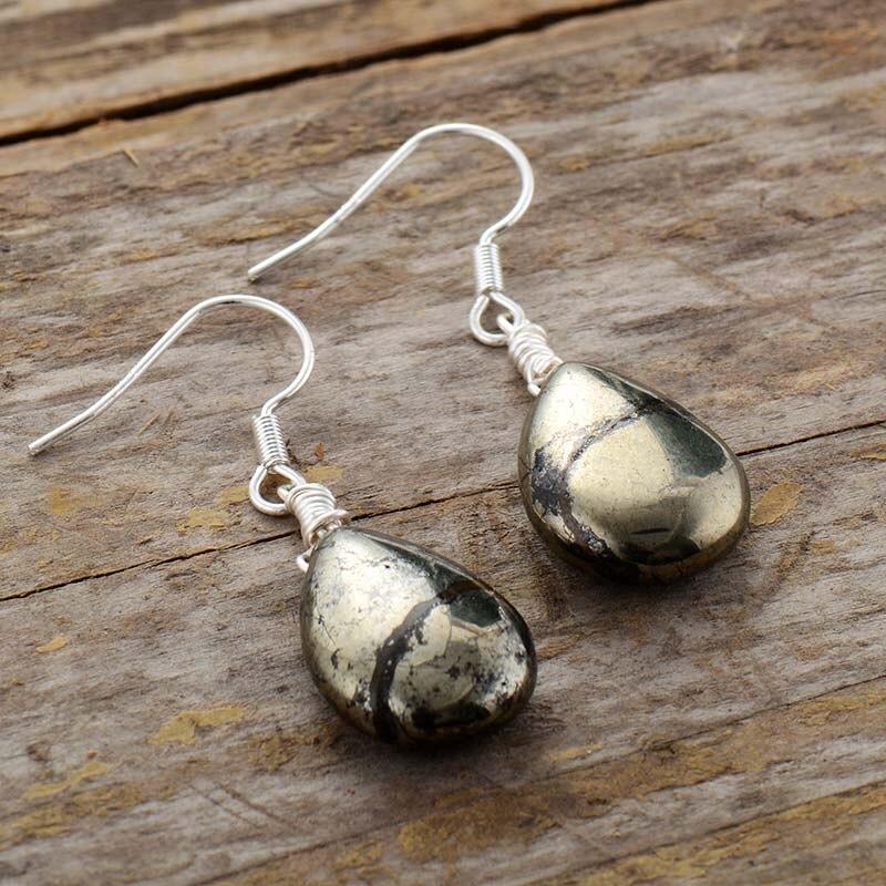 Women's Elara reflective pyrite drop earrings. Handmade silver jewelry for protection and unique style.