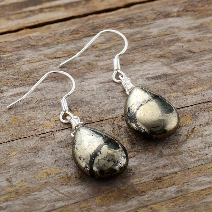 Women's Elara reflective pyrite drop earrings. Handmade silver jewelry for protection and unique style.