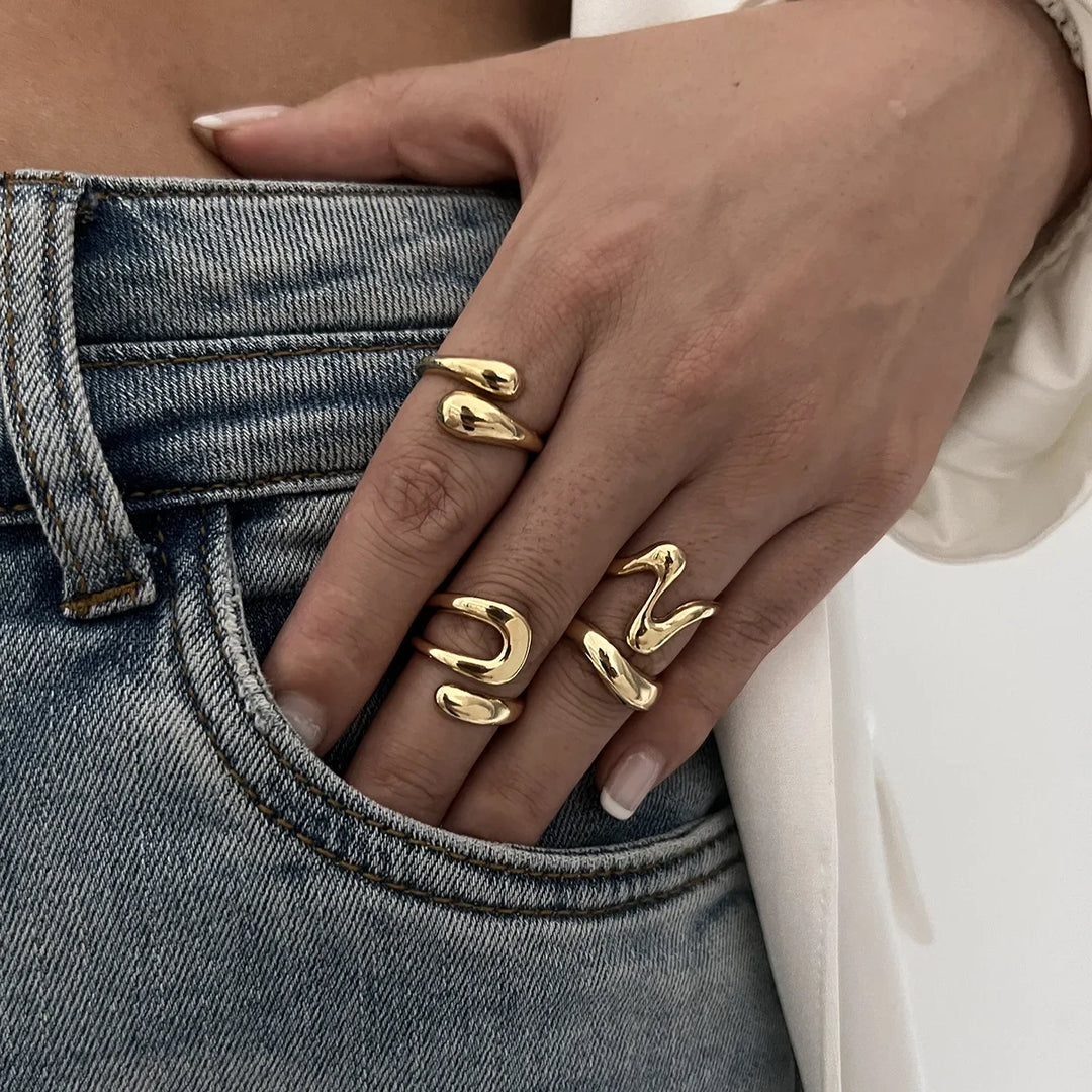 Woman's hand modeling Elavon Fluid Metal Ring Set, elegant statement jewelry for women.