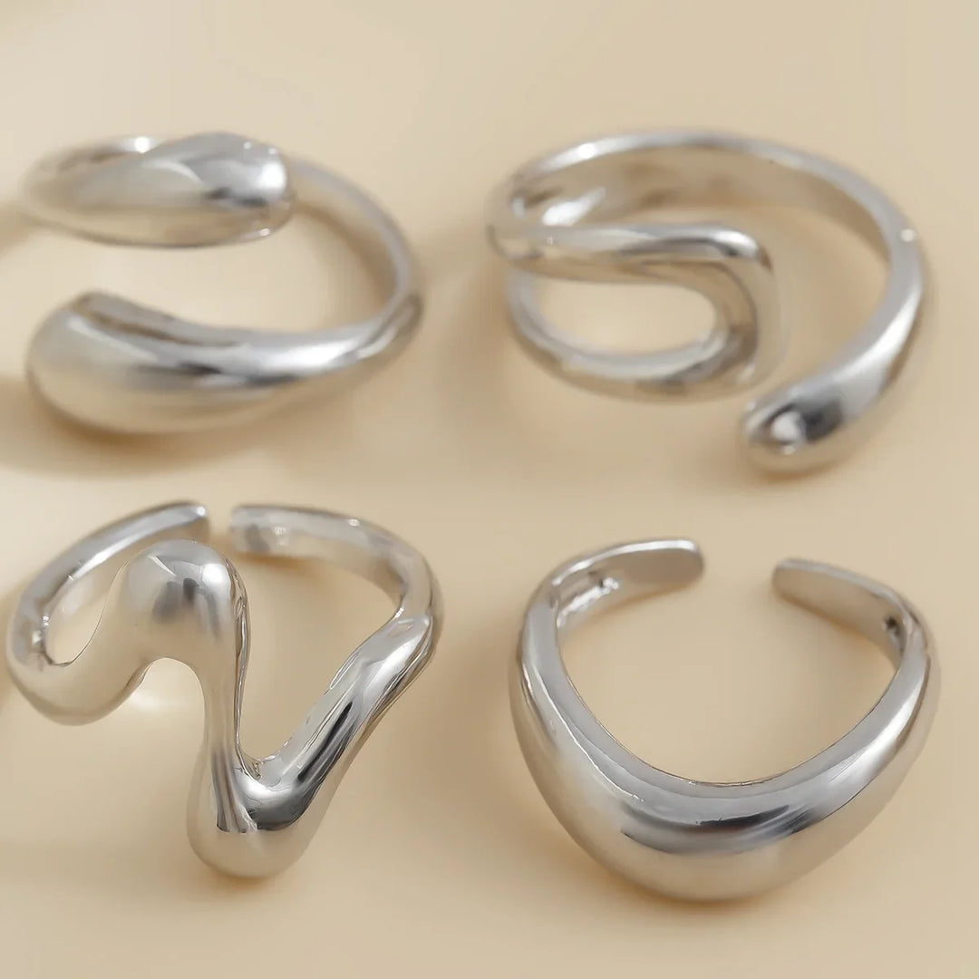 Versatile Elavon Fluid Metal Ring Set, multiple sculptural rings, elegant women's fashion jewelry.