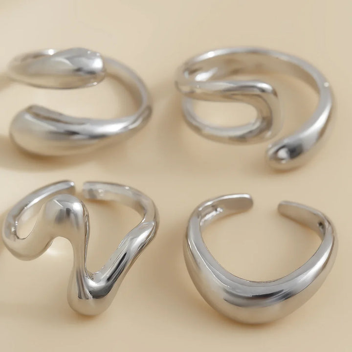 Versatile Elavon Fluid Metal Ring Set, multiple sculptural rings, elegant women's fashion jewelry.