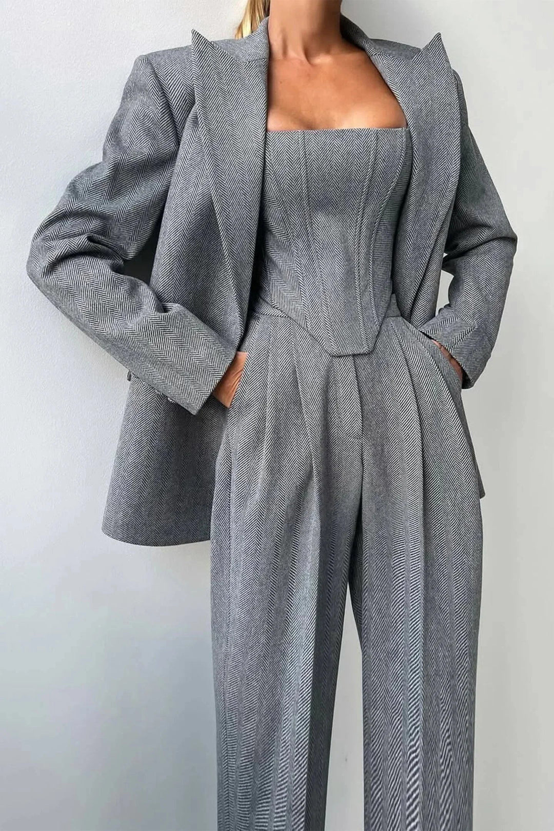 Women's elegant 3-piece power suit with corset bustier, wide leg pants & oversized blazer.