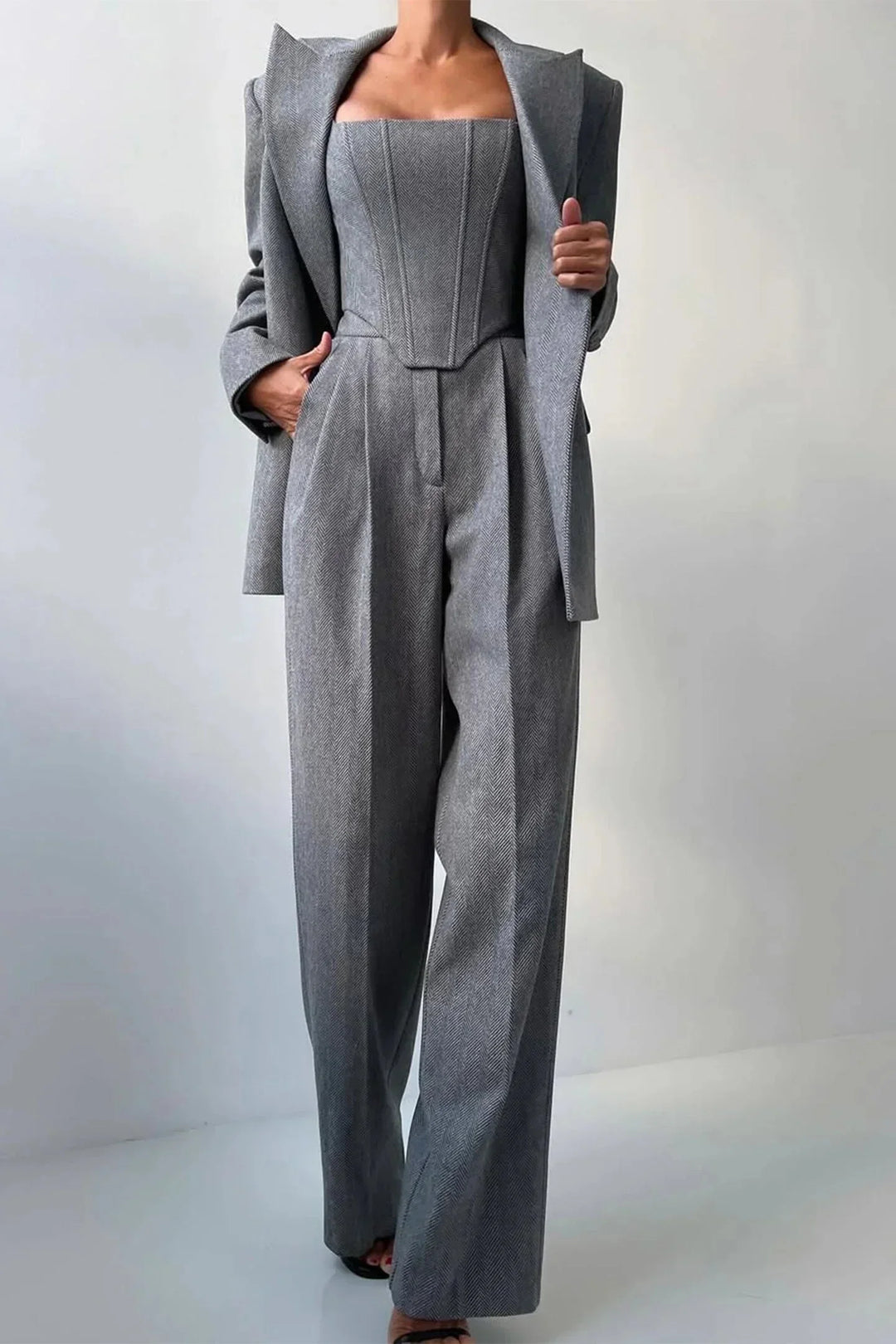 Business chic women's 3-piece set featuring elegant corset, wide leg pants & oversized blazer.