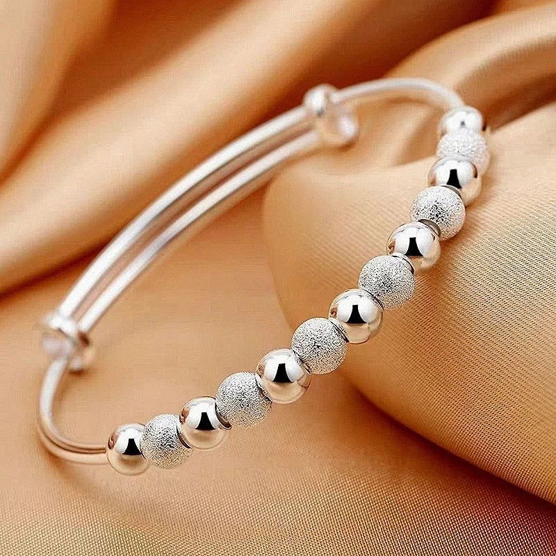 Close-up of the luxurious charm on the women's silver party bracelet, showcasing intricate detail.